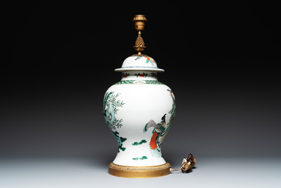 A Chinese famille verte vase and cover mounted as a lamp, 19th C.