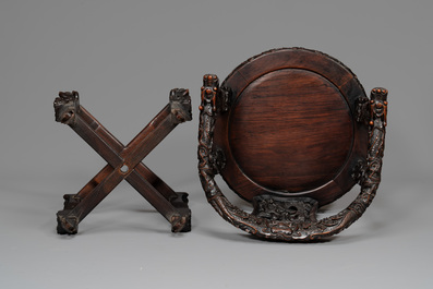 A pair of Chinese finely carved hongmu swivel chairs, Canton, 19th C.