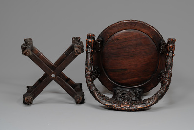 A pair of Chinese finely carved hongmu swivel chairs, Canton, 19th C.