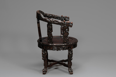 A pair of Chinese finely carved hongmu swivel chairs, Canton, 19th C.
