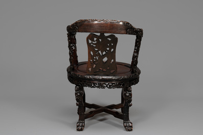 A pair of Chinese finely carved hongmu swivel chairs, Canton, 19th C.
