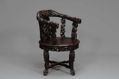 A pair of Chinese finely carved hongmu swivel chairs, Canton, 19th C.