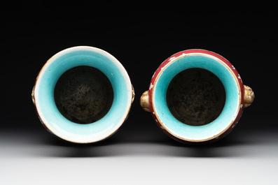 A pair of Chinese famille rose ruby-ground 'landscape' vases, 19th C.