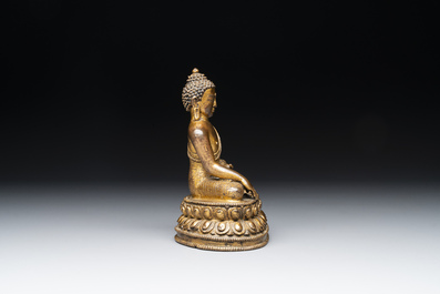 A fine Sino-Tibetan gilt bronze Buddha, 15/16th C.