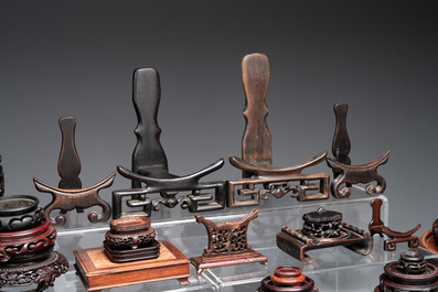 A collection of 55 Chinese wooden stands, 19/20th C.
