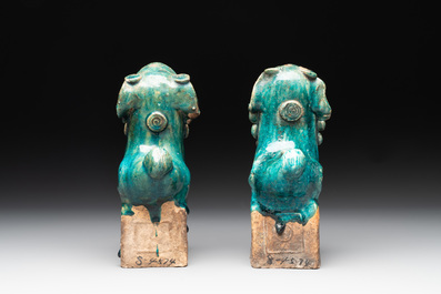 A pair of Chinese turquoise-glazed Buddhist lions on stands, probably Swatow kilns, 19th C.