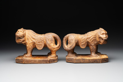 A pair of Chinese archaistic stone mythical beasts, 20th C.