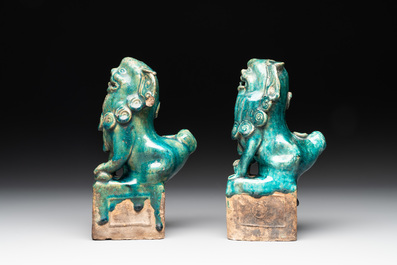 A pair of Chinese turquoise-glazed Buddhist lions on stands, probably Swatow kilns, 19th C.