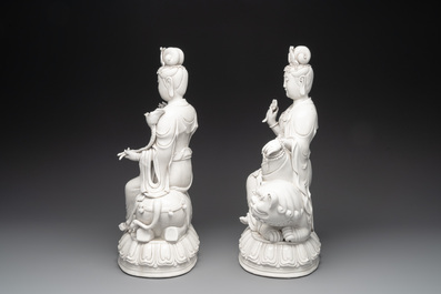 A pair of Chinese Dehua blanc de Chine Bodhisattvas seated on an elephant and a Buddhist lion, 20th C.