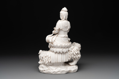 A Chinese Dehua blanc de Chine Bodhisattva seated on a Buddhist lion, 20th C.