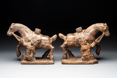 A pair of Chinese archaistic carved stone horses, 20th C.