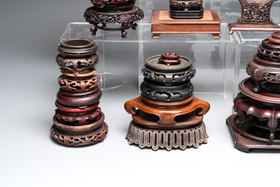A collection of 55 Chinese wooden stands, 19/20th C.
