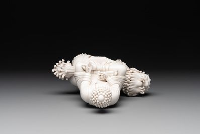 A Chinese Dehua blanc de Chine Buddha seated on a lion, 20th C.
