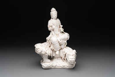 A Chinese Dehua blanc de Chine Bodhisattva seated on a Buddhist lion, 20th C.