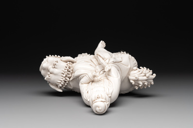 A Chinese Dehua blanc de Chine Guanyin with a ruyi sceptre seated on a Buddhist lion, 20th C.