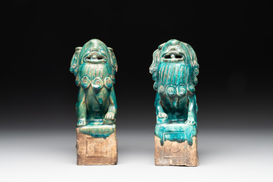 A pair of Chinese turquoise-glazed Buddhist lions on stands, probably Swatow kilns, 19th C.