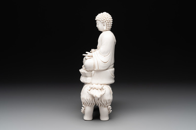 A Chinese Dehua blanc de Chine Buddha seated on a lion, 20th C.