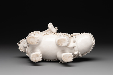 A Chinese Dehua blanc de Chine Guanyin with a ruyi sceptre seated on a Buddhist lion, 20th C.