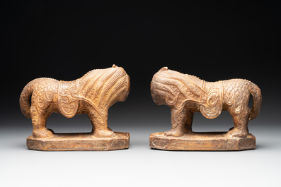 A pair of Chinese archaistic stone mythical beasts, 20th C.
