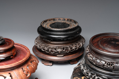 A collection of 11 Chinese wooden stands, 19/20th C.