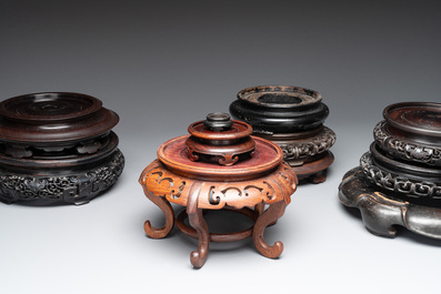 A collection of 11 Chinese wooden stands, 19/20th C.