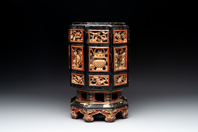 A Chinese octagonal gilt-lacquered wooden stand and four wooden carvings on stands, 19th C.
