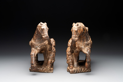 A pair of Chinese archaistic carved stone horses, 20th C.