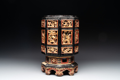 A Chinese octagonal gilt-lacquered wooden stand and four wooden carvings on stands, 19th C.