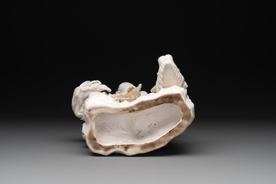 A Chinese Dehua blanc de Chine Bodhisattva seated on a Buddhist lion, 20th C.