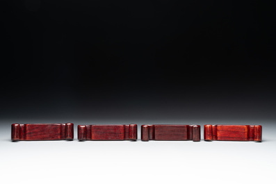 A Chinese octagonal gilt-lacquered wooden stand and four wooden carvings on stands, 19th C.