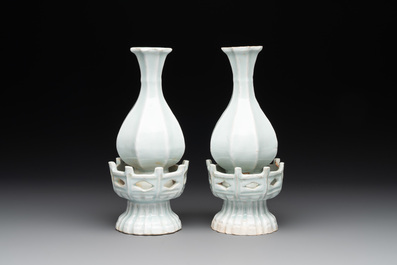 A pair of Chinese qingbai vases and a cup on a stand, 20th C.