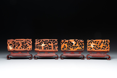 A Chinese octagonal gilt-lacquered wooden stand and four wooden carvings on stands, 19th C.