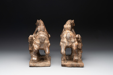 A pair of Chinese archaistic carved stone horses, 20th C.