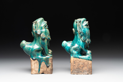 A pair of Chinese turquoise-glazed Buddhist lions on stands, probably Swatow kilns, 19th C.