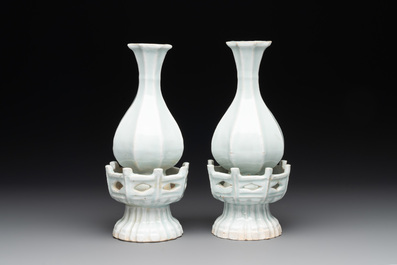 A pair of Chinese qingbai vases and a cup on a stand, 20th C.