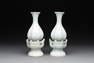 A pair of Chinese qingbai vases and a cup on a stand, 20th C.