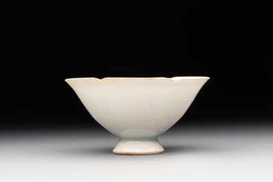 A pair of Chinese qingbai vases and a cup on a stand, 20th C.
