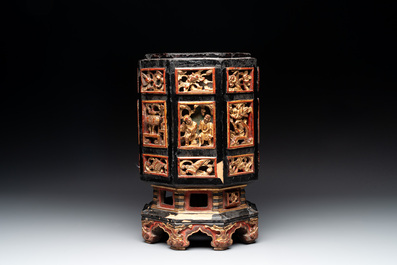 A Chinese octagonal gilt-lacquered wooden stand and four wooden carvings on stands, 19th C.
