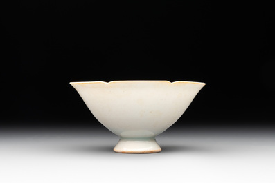 A pair of Chinese qingbai vases and a cup on a stand, 20th C.