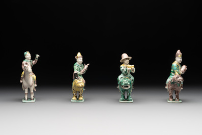 Eight Chinese verte biscuit figures riding mythical animals, 19/20th C.