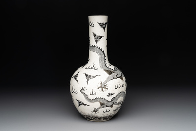 A Chinese black-enamelled  biscuit 'dragon' vase, Qianlong mark, 19th C.