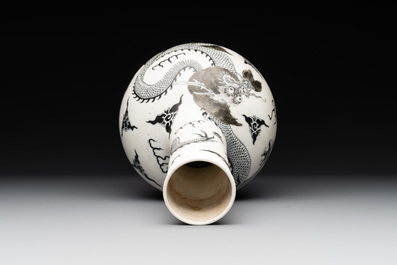 A Chinese black-enamelled  biscuit 'dragon' vase, Qianlong mark, 19th C.