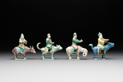 Eight Chinese verte biscuit figures riding mythical animals, 19/20th C.