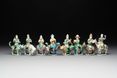 Eight Chinese verte biscuit figures riding mythical animals, 19/20th C.