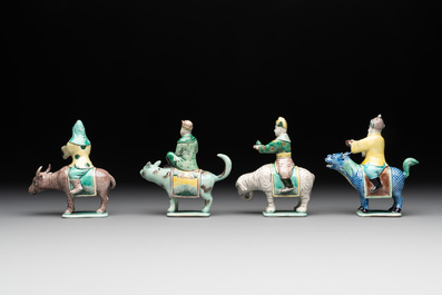 Eight Chinese verte biscuit figures riding mythical animals, 19/20th C.