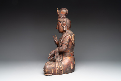A Chinese gilt-lacquered wooden sculpture of Buddha, 18/19th C.