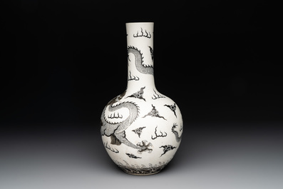 A Chinese black-enamelled  biscuit 'dragon' vase, Qianlong mark, 19th C.