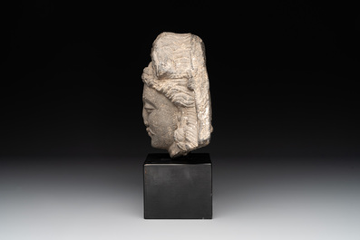 A Gandhara grey schist relief fragment of a Bodhisattva head, 2nd/3rd C.