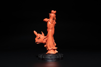 A Chinese red coral sculpture of a lady accompanied by four doves on wooden stand, 19/20th C.