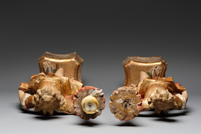 A pair of gilt and polychromed wooden angel-form candlesticks, Germany, 18/19th C.
